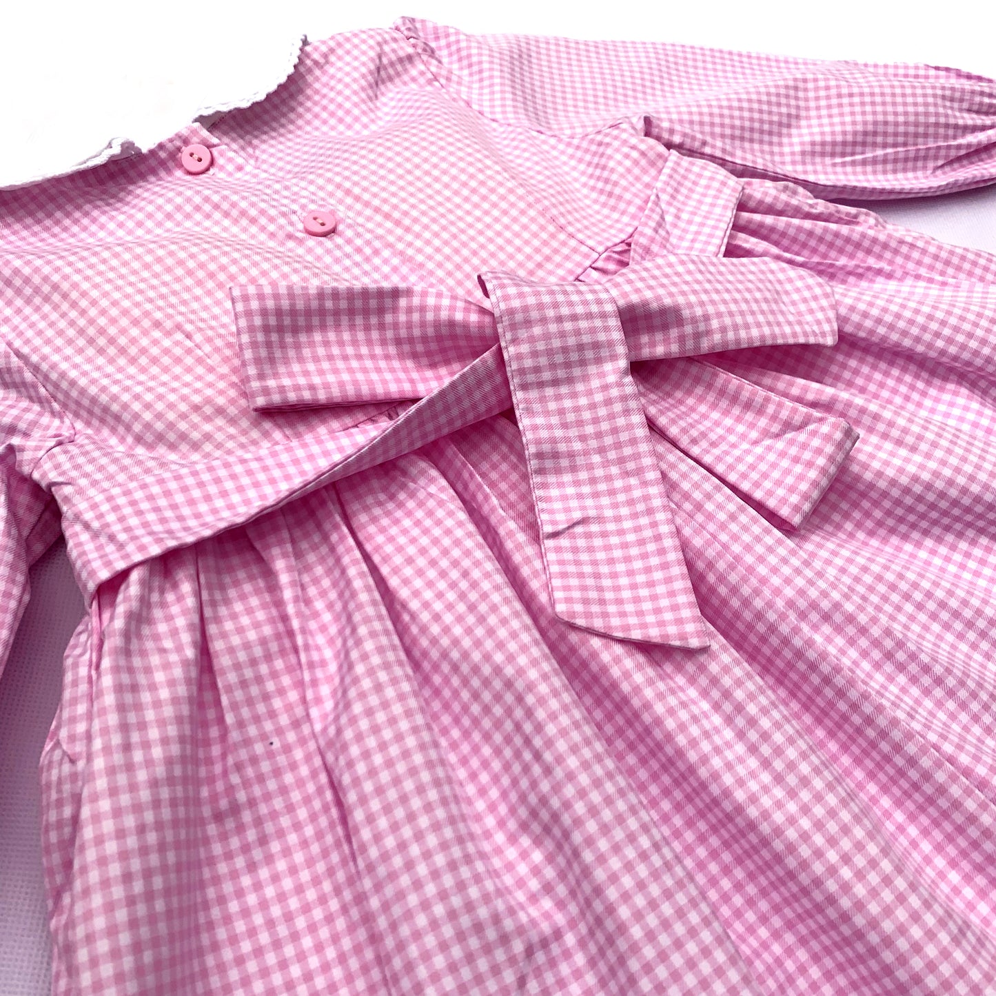 Stunning pink dress hand smocked with tricolor roses.