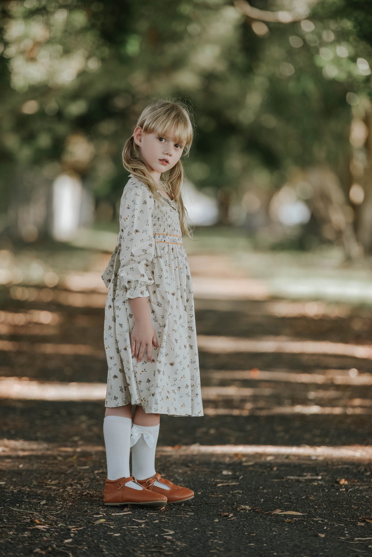 Cream long sleeves hand smocked dress.