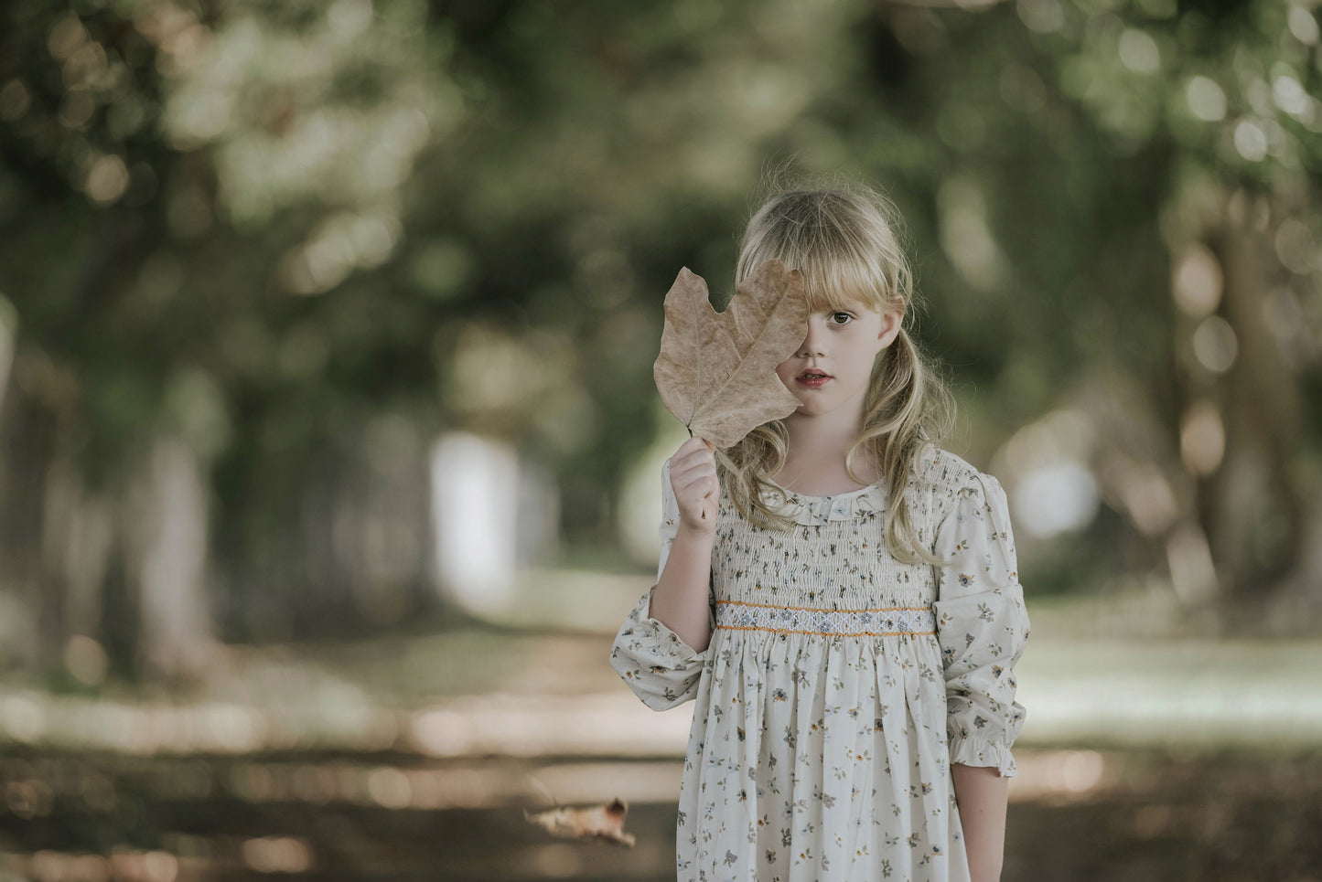 Cream long sleeves hand smocked dress.