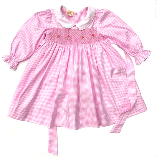Stunning pink dress hand smocked with tricolor roses.