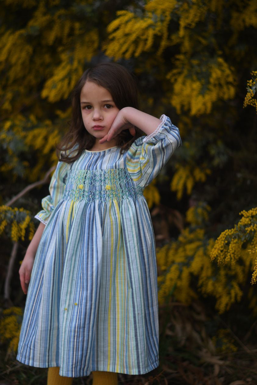 Tasteful long sleeves yellow and blue striped smocked dress