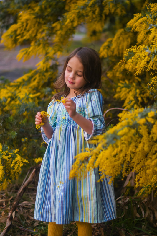 Tasteful long sleeves yellow and blue striped smocked dress